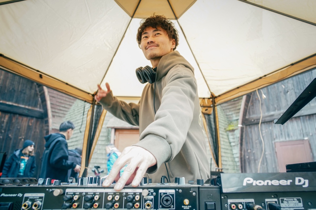 YUKI.T playing an outdoor festival stage